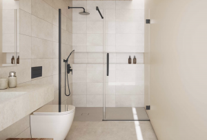 mampara Ducha sin barreras con azulejos tipo microcemento y grifería negra.